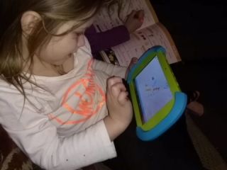 child on pbs tablet